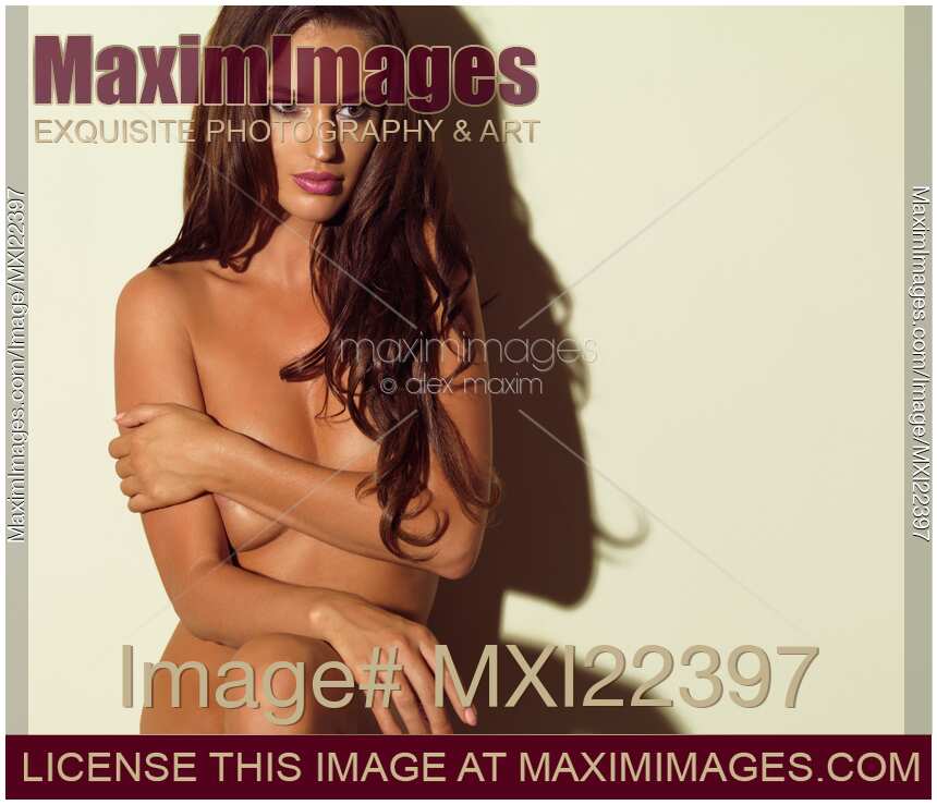 Beautiful Naked Woman Standing at a Wall