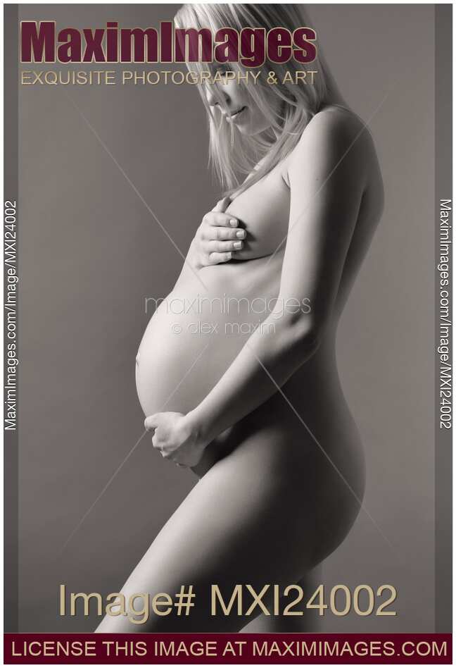 Beautiful nude pregnant woman studio portrait