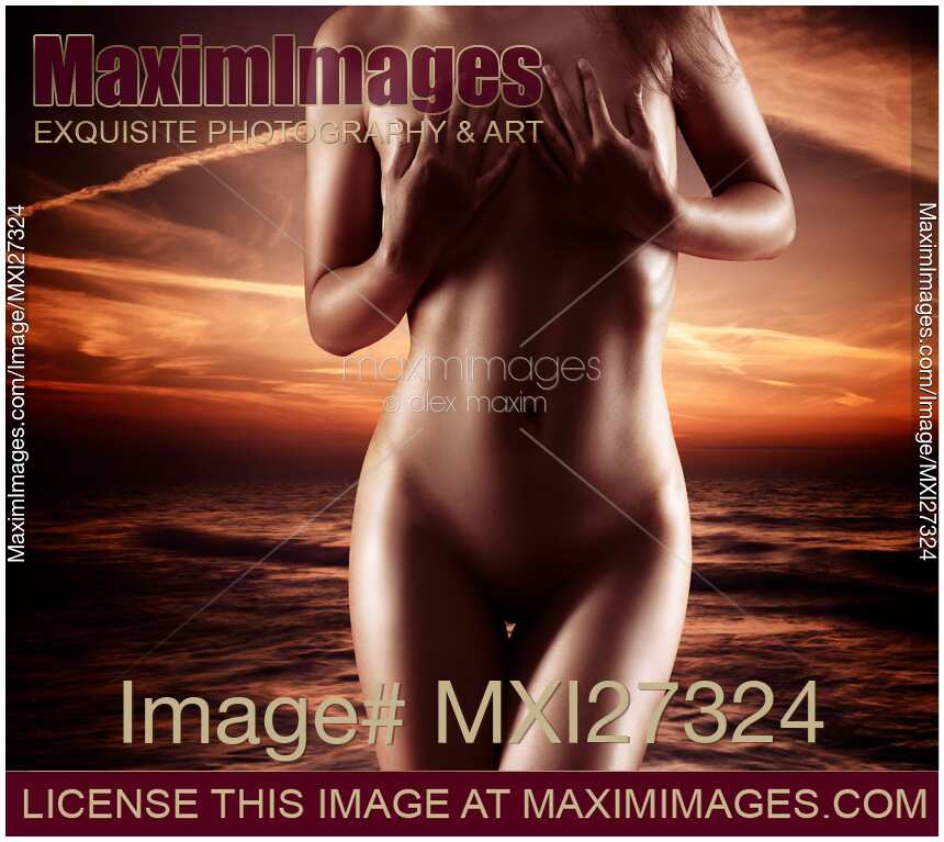 Beautiful nude woman coming out of the water