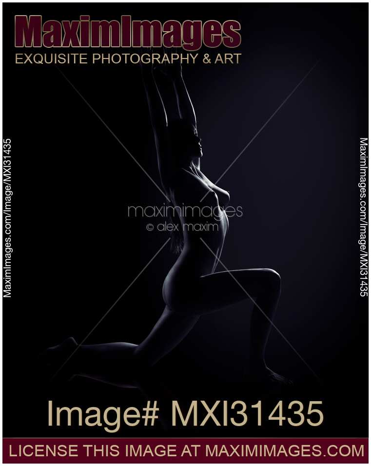 Beautiful nude woman in a low lunge yoga pose naked body silhouette on black