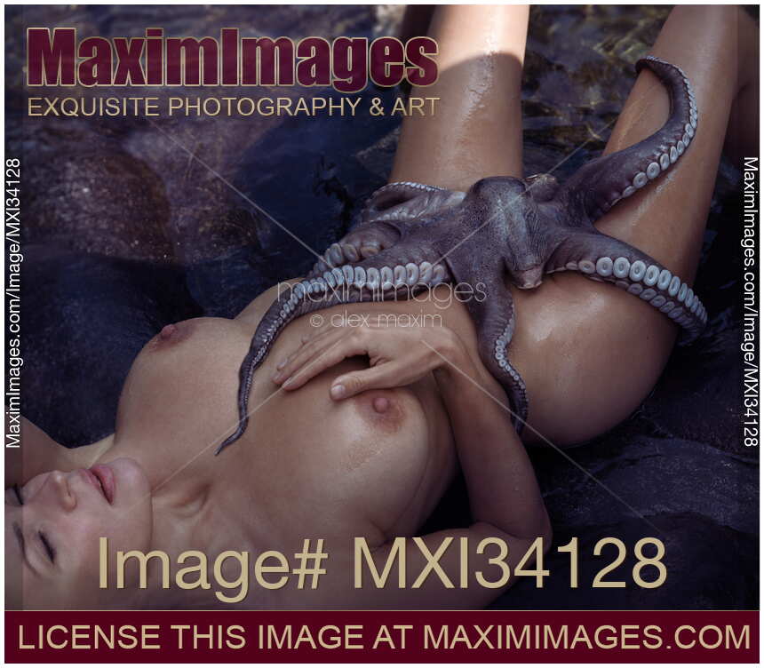 Beautiful nude woman lying on a shore with an octopus caressing her naked sensual body with tentacles