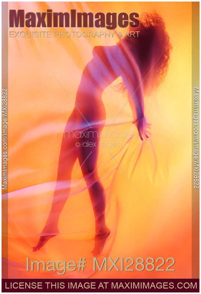 Beautiful nude woman silhouette floating behind sheer surreal glowing veil
