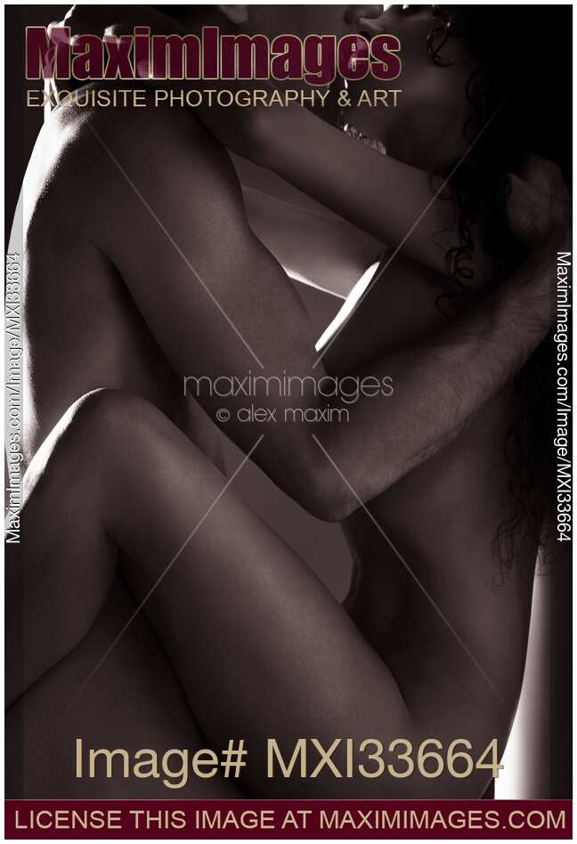 Beautiful sensual couple making love naked kissing in a passionate embrace of their nude bodies Black and white