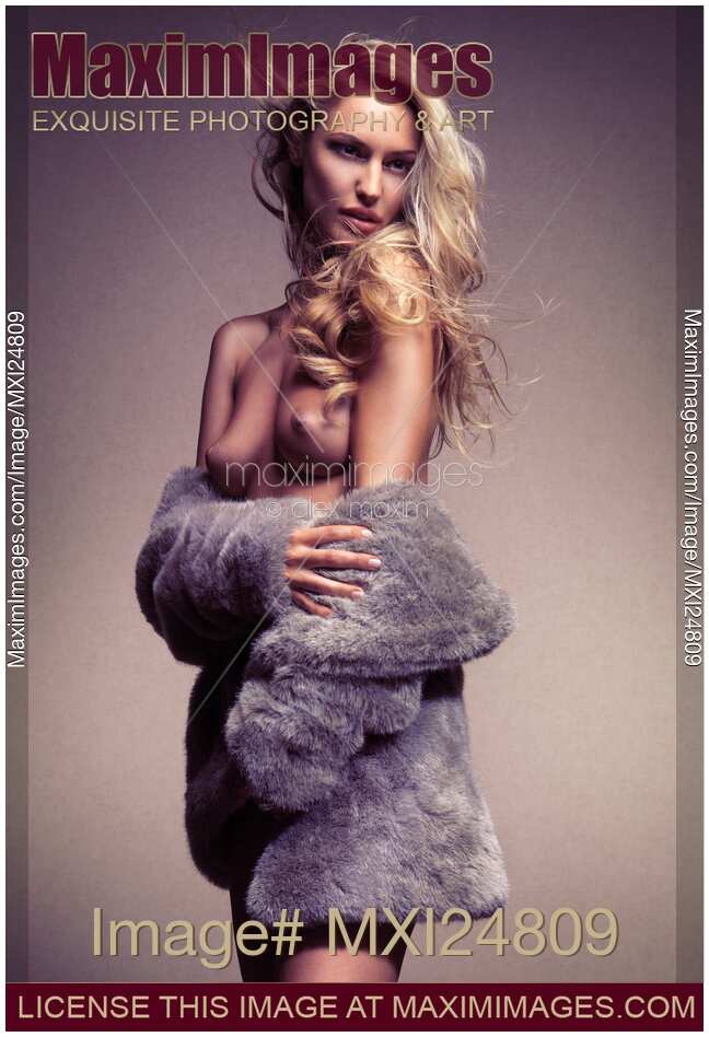 Beautiful sexy half naked woman in fur jacket
