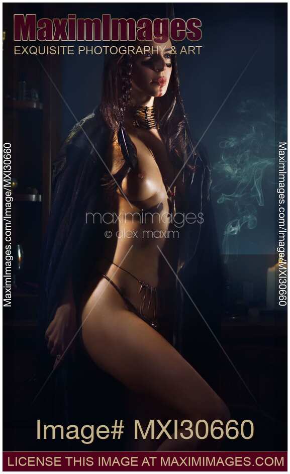 Beautiful sexy half nude Native American woman tribal shaman in black cloak