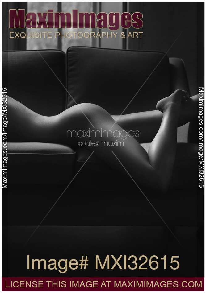 Beautiful sexy nude woman lying on a couch body curvy outline Body parts midsection closeup Black and white