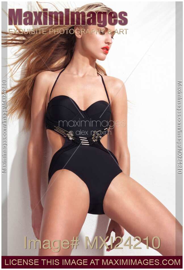 Beautiful sexy young woman wearing a trendy one-piece swimsuit