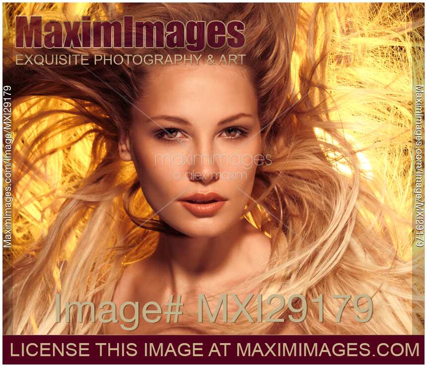 Beautiful Woman closeup portrait with Flying Golden Hair