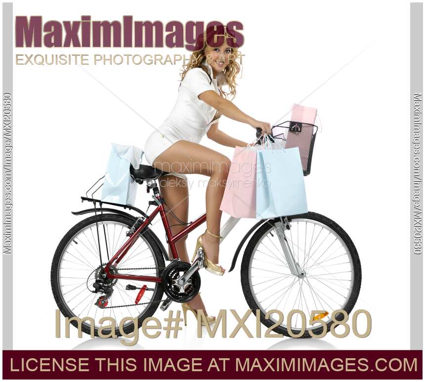 Beautiful Woman Doing Shopping on a Bike