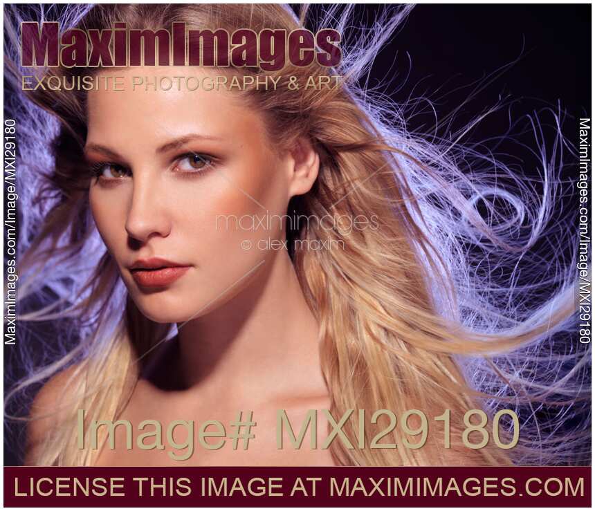 Beautiful Woman Face with expressive look and flying blond hair