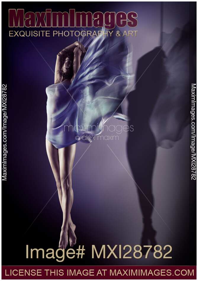 Beautiful woman flying wrapped in flowing cloth while shadow of her body is suspended with rope