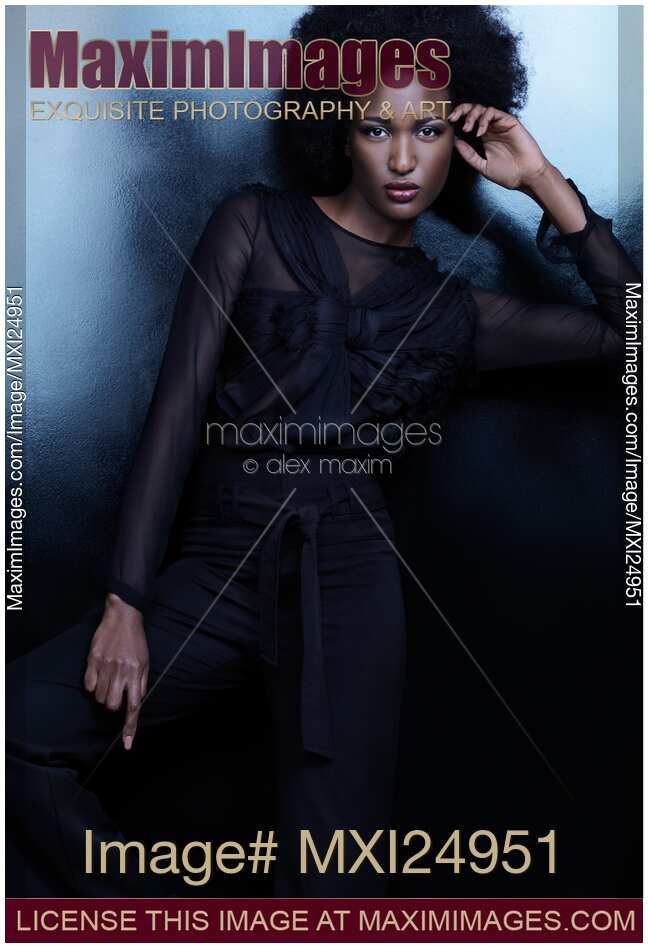 Beautiful woman in black clothes high fashion photo