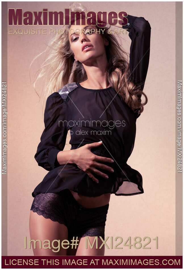 Beautiful woman in black see-through top and underwear