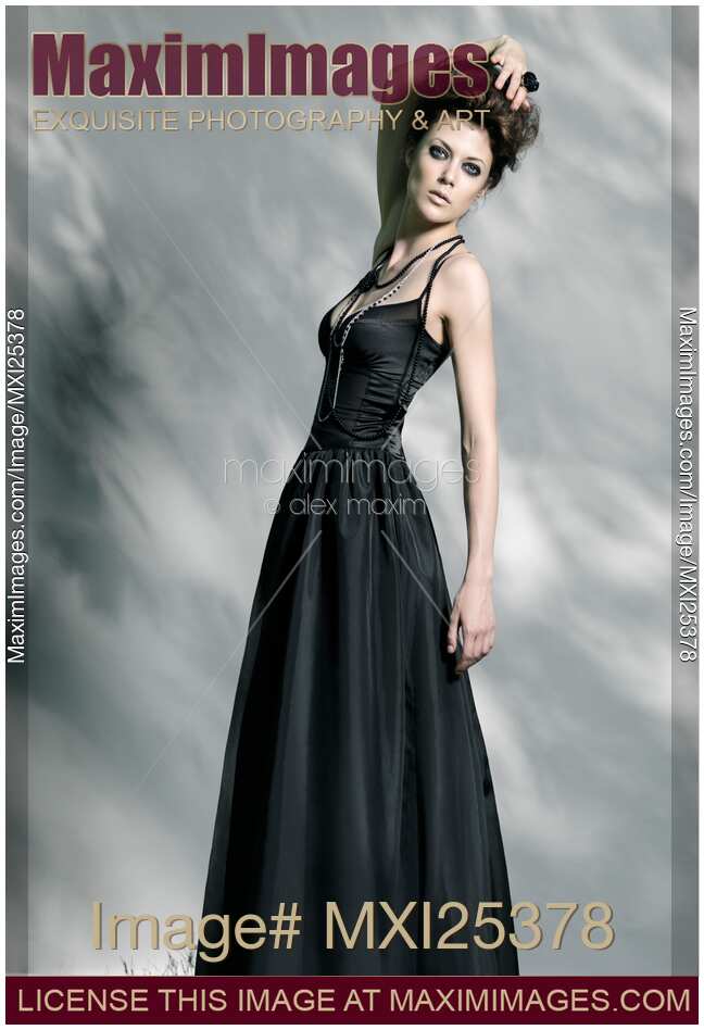 Beautiful woman in black vintage dress