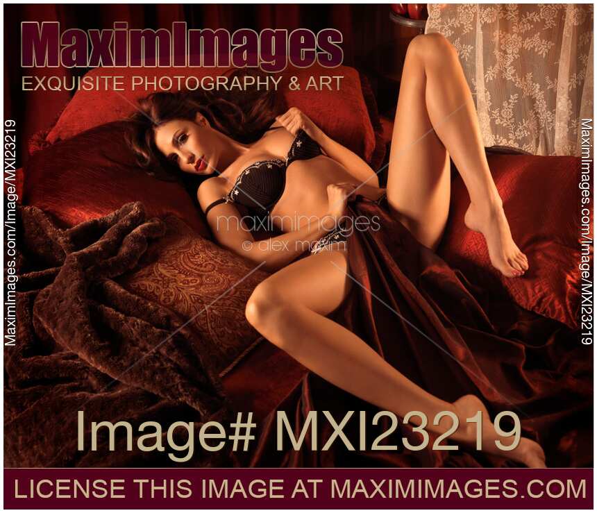 Beautiful woman in lingerie lying on a bed
