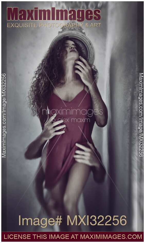 Beautiful woman in red nightgown with male hands caressing her body from behind Sexual fantasy concept