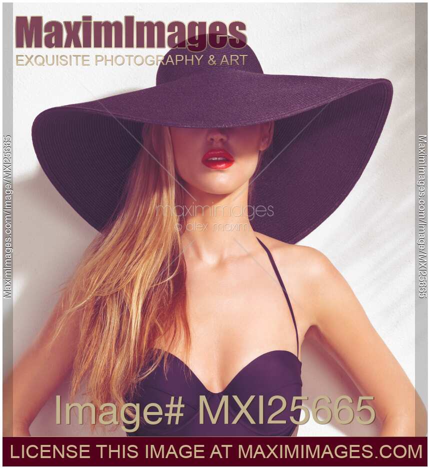 Beautiful woman in sunhat and swimsuit