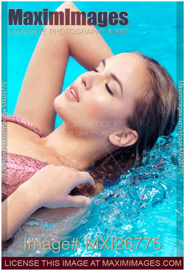 Beautiful woman lying in water closeup of face