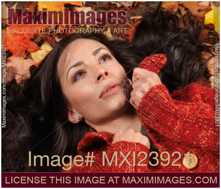 Beautiful Woman Lying on Fallen Leaves