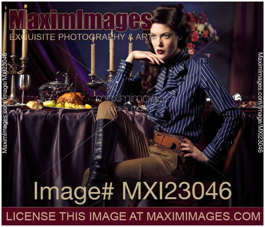 Beautiful Woman Sitting at a Festive Table