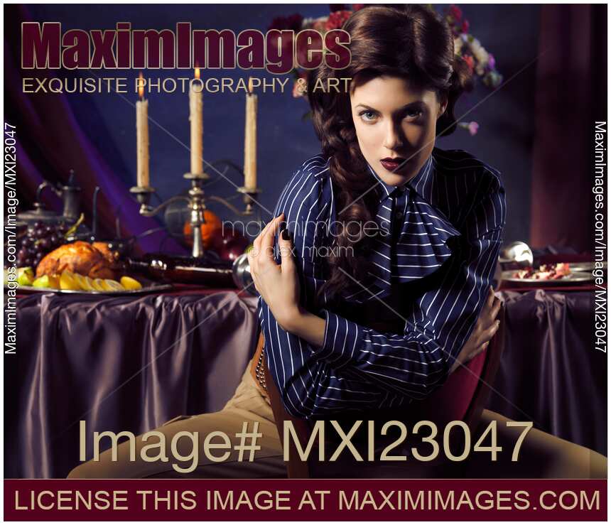 Beautiful Woman Sitting at a Festive Table