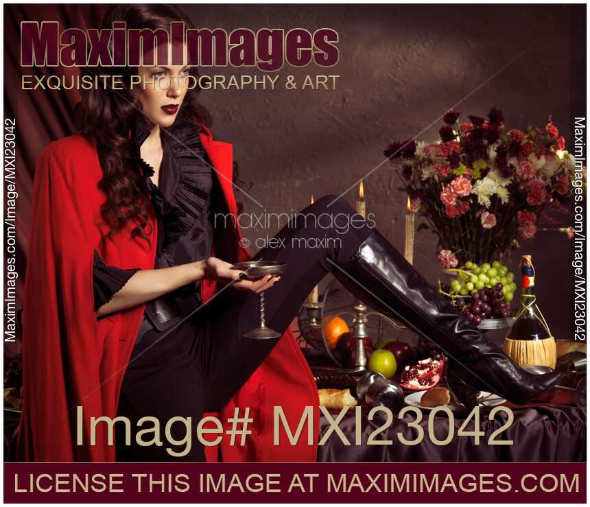 Beautiful Woman Sitting on a Festive Table