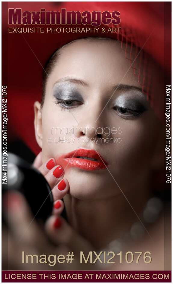 Beautiful Woman Smearing Lipstick