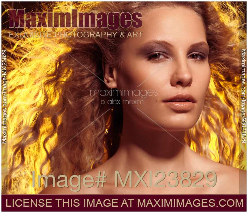 Beautiful Woman with Flying Golden Hair
