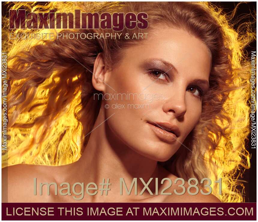 Beautiful Woman with Flying Golden Hair