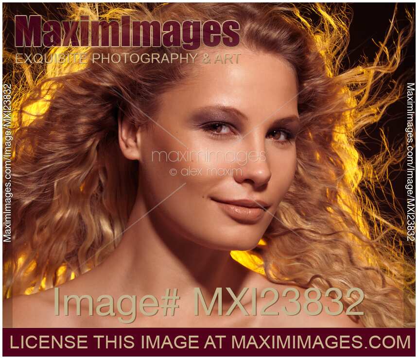 Beautiful Woman with Flying Golden Hair