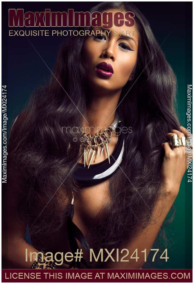 Beautiful woman with long hair wearing jewellery