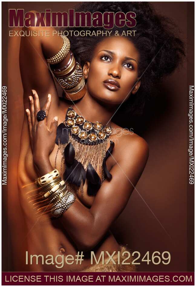 Beautiful Young African American Woman Wearing Jewelry on Brown Background