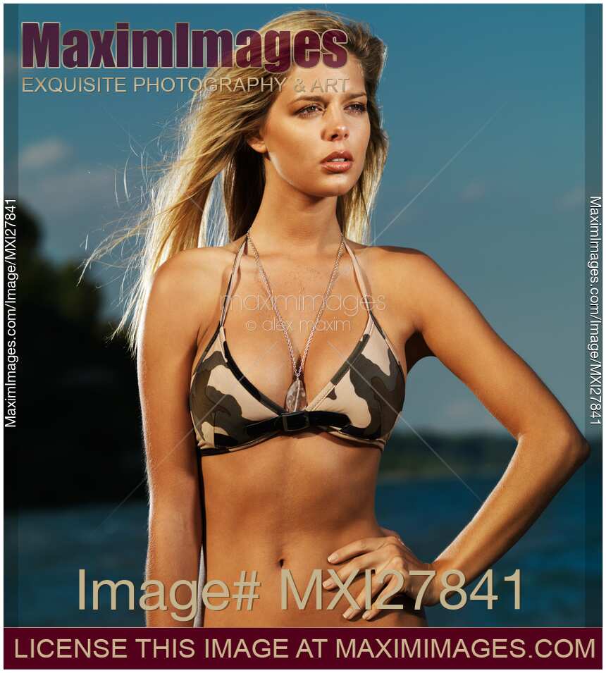 Beautiful young blond woman at the beach