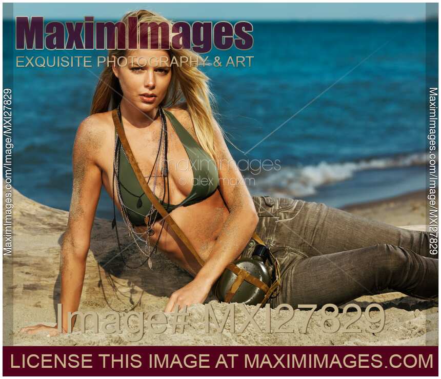 Beautiful young blond woman on the beach