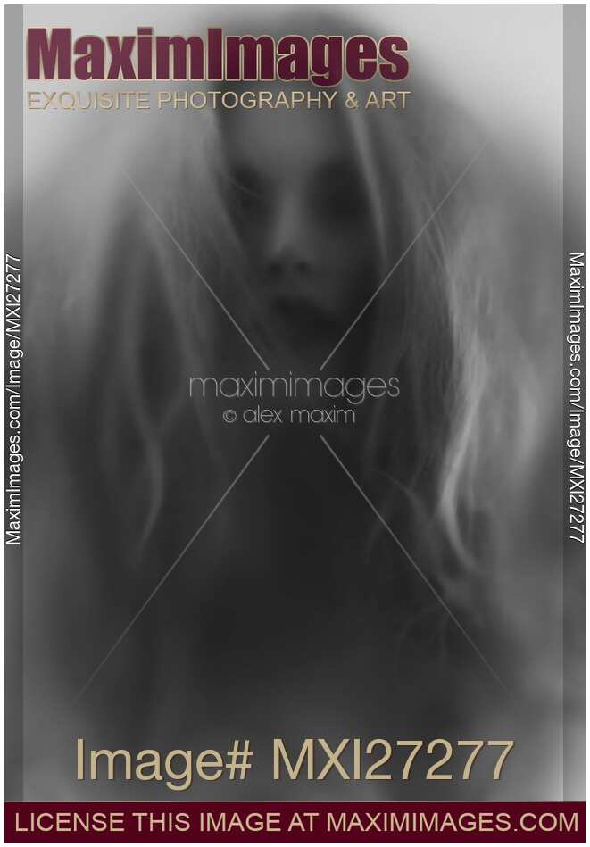 Beautiful young woman face behind hazy glass