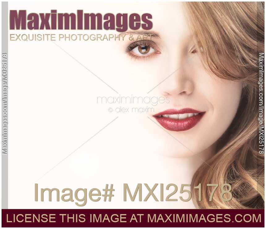 Beautiful young woman face blending into light background
