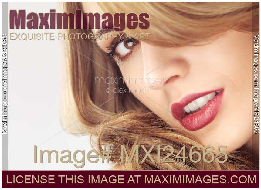 Beautiful young woman face with sensual hair