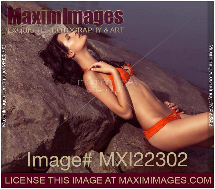 Beautiful Young Woman in Orange Bikini