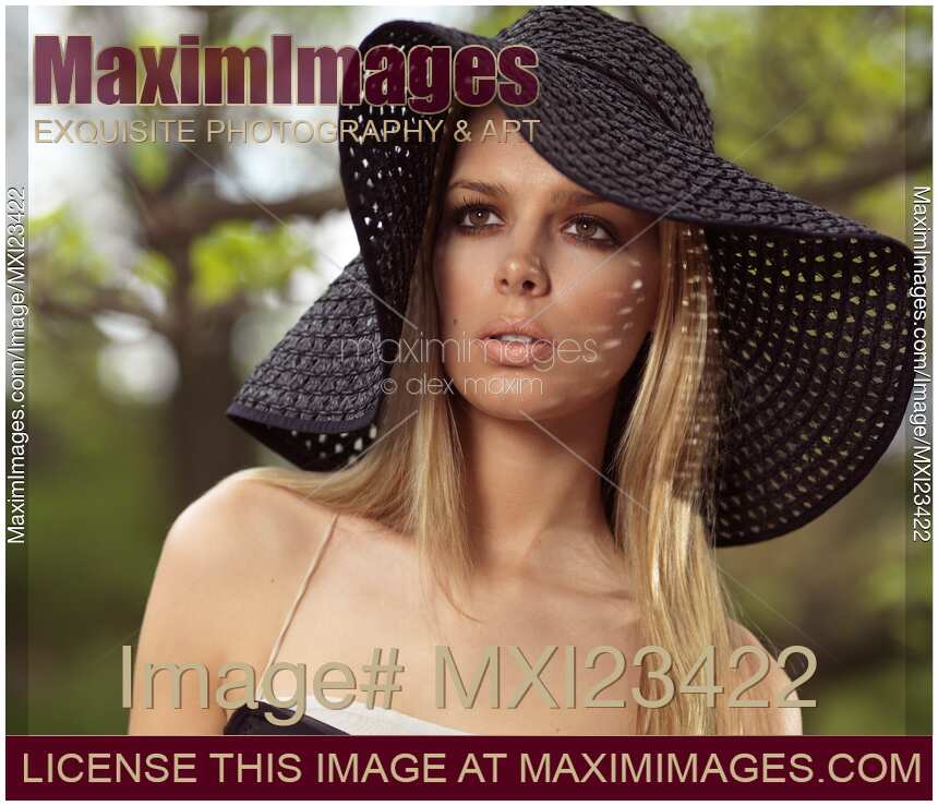 Beautiful Young Woman in Sunhat