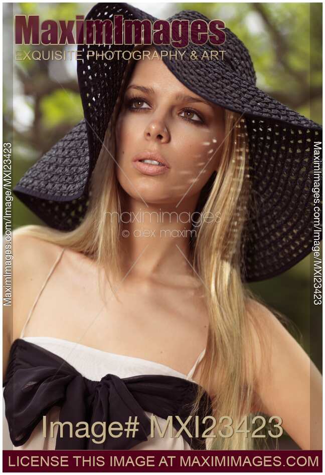 Beautiful Young Woman in Sunhat