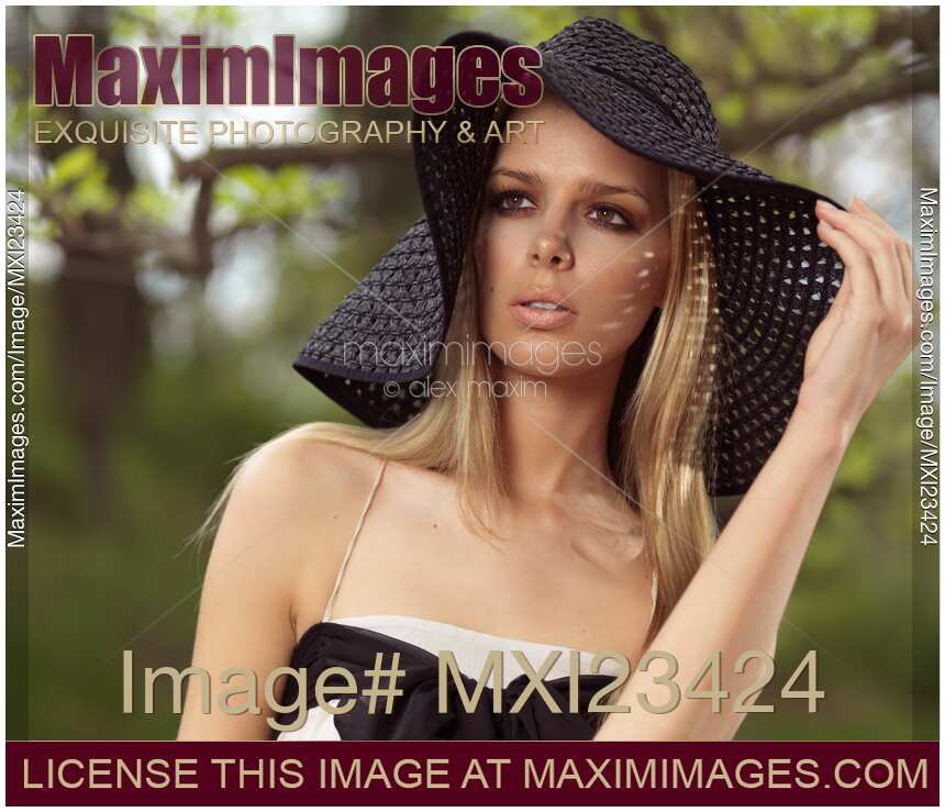 Beautiful Young Woman in Sunhat