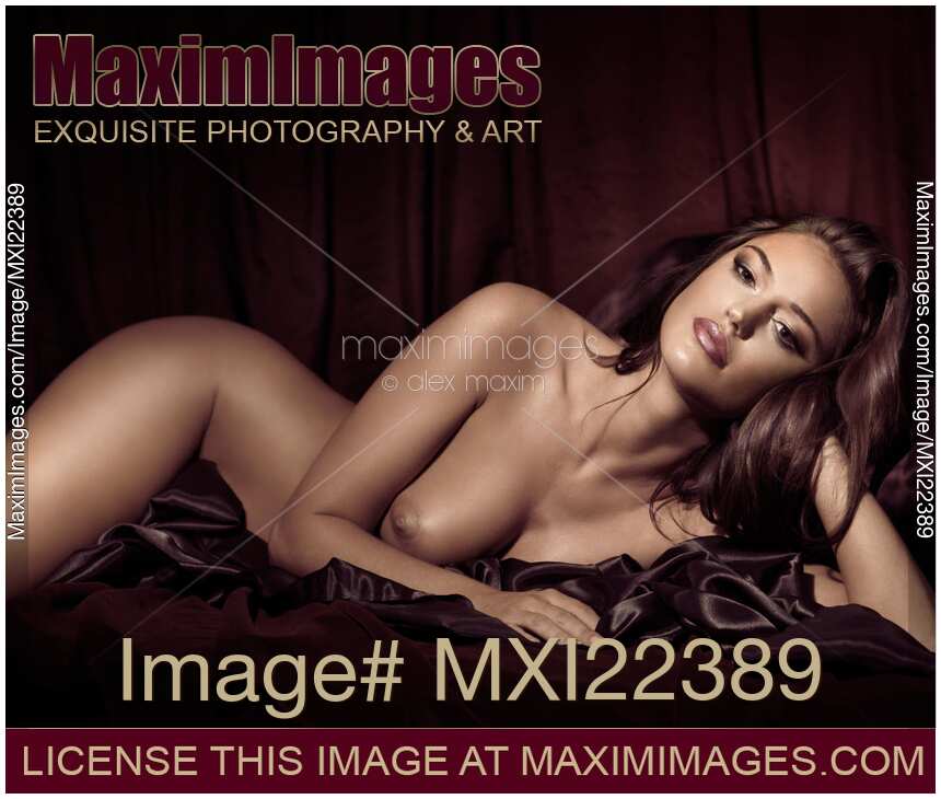 Beautiful Young Woman Lying Naked in Bed Boudoir portrait