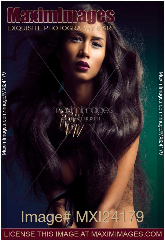 Beautiful young woman with long flying hair