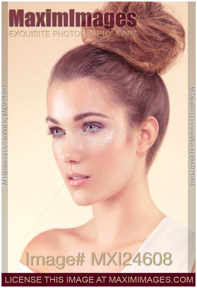 Beautiful young woman with natural look and updo