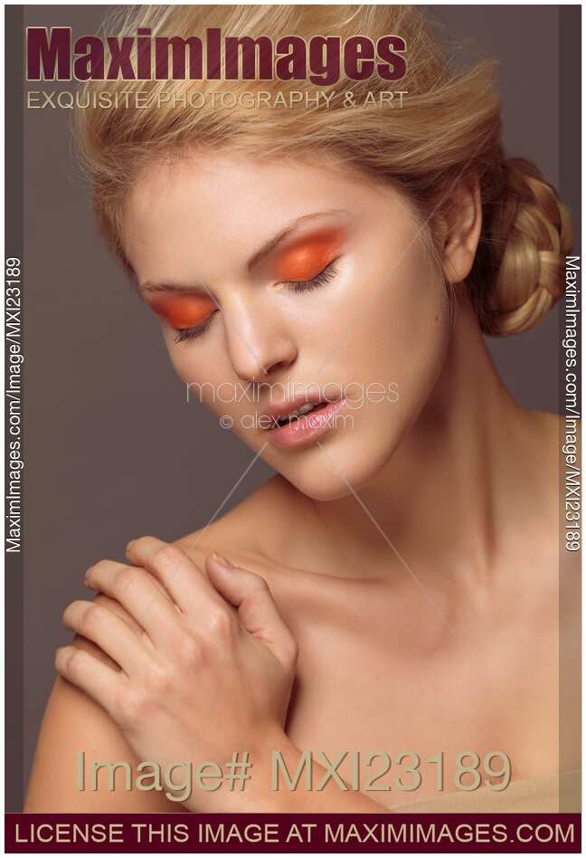 Beautiful Young Woman with Orange Eyeshadow