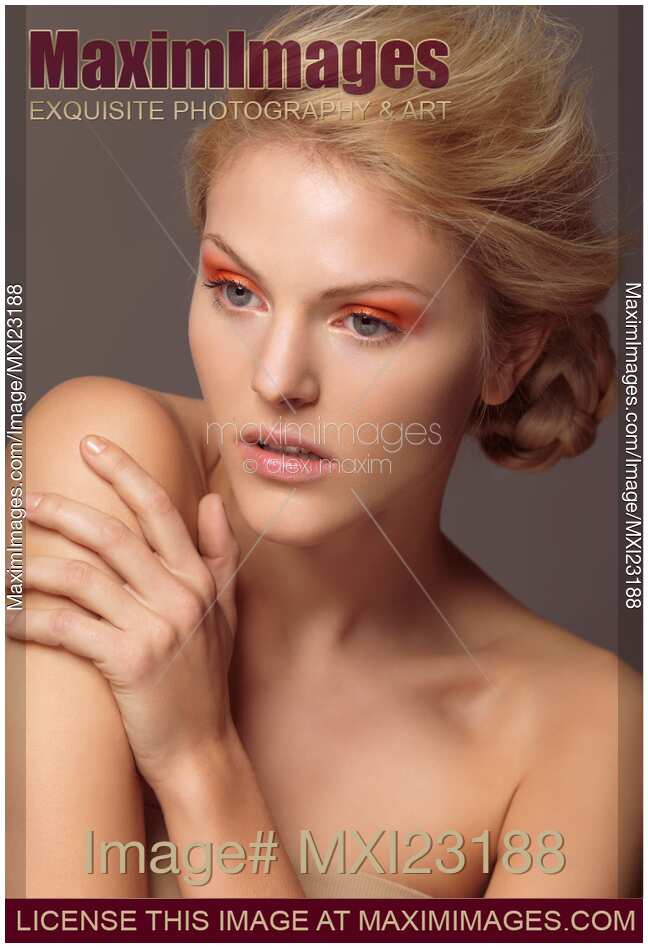 Beautiful Young Woman with Orange Eyeshadows