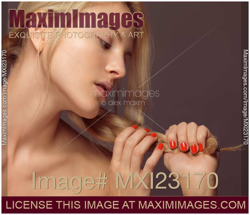 Beautiful Young Woman with Orange Nail Polish