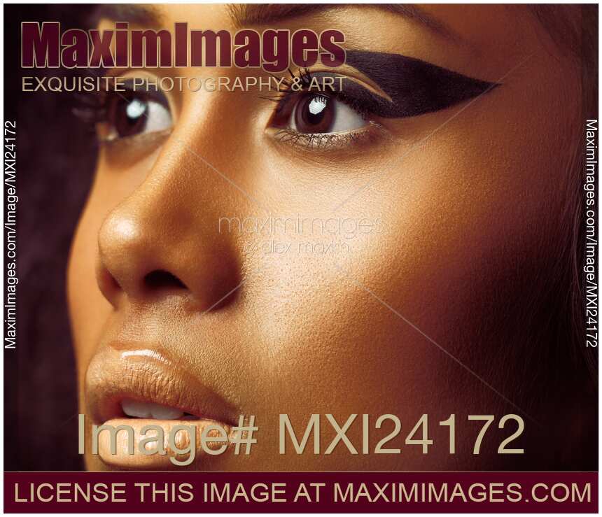 Beauty closeup of face with exotic makeup