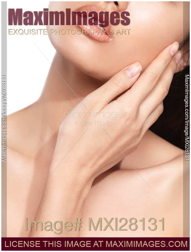 Beauty closeup of young woman hand touching face