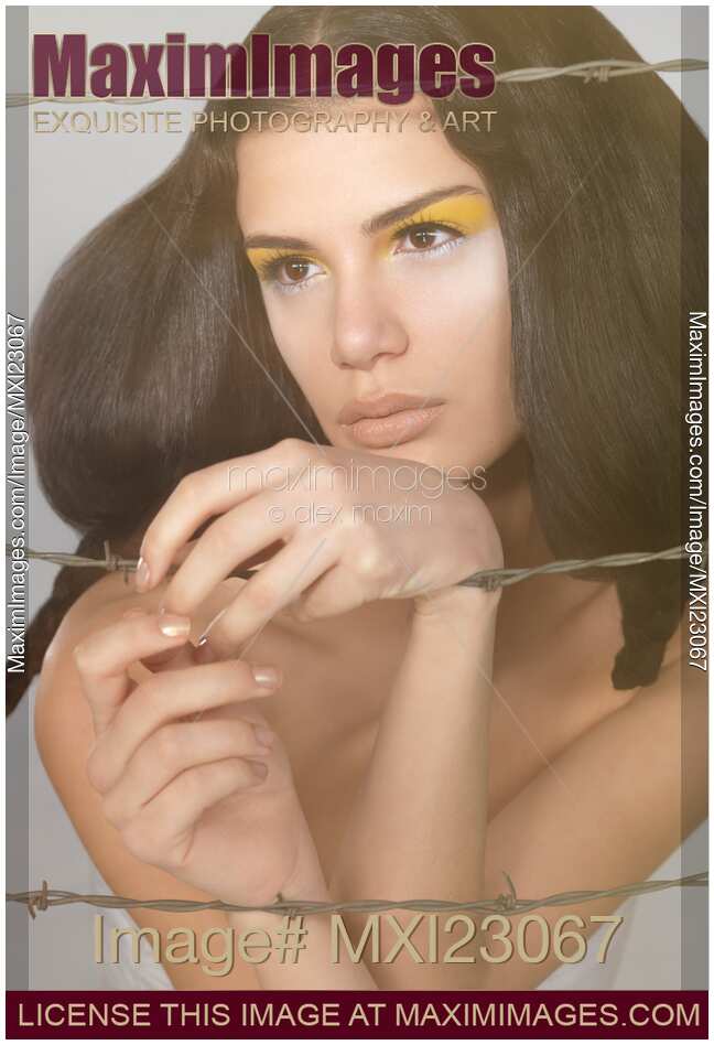 Beauty Portrait of a Woman Behind Barbed Wire